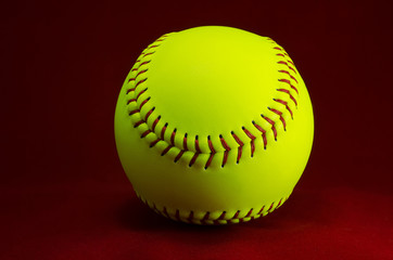 Wall Mural - Softball on a red background