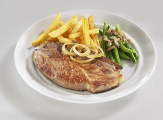 Wall Mural - Pork neck steak with chips and green beans