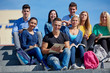 © .shock - students outside sitting on steps