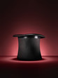 magic top hat on red - Stock Image