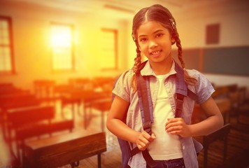 Poster - Composite image of cute pupil smiling at camera