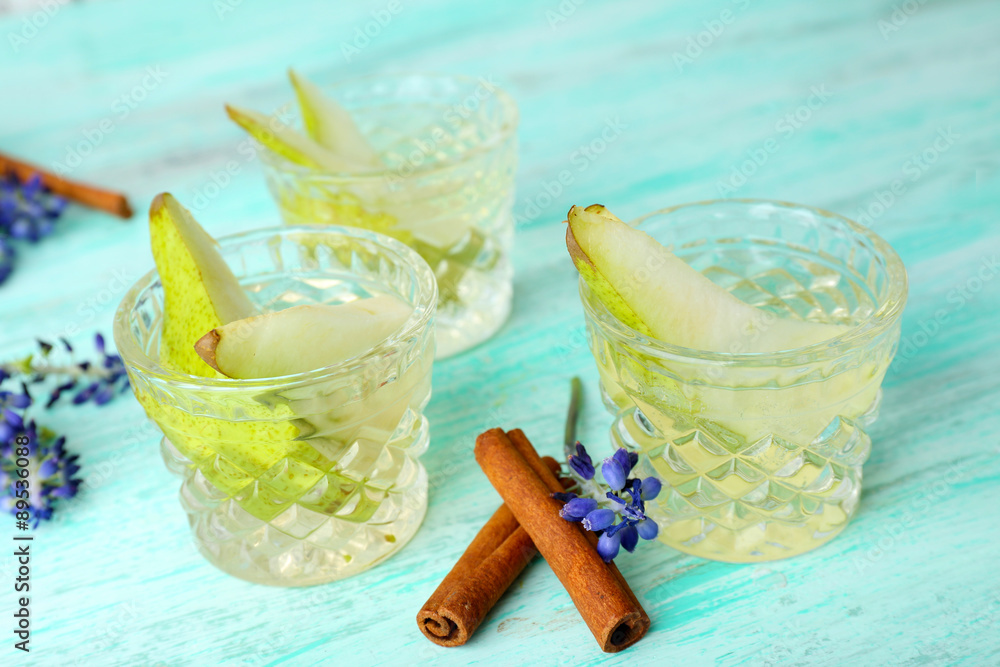 Pear juice with fresh fruits on table close up