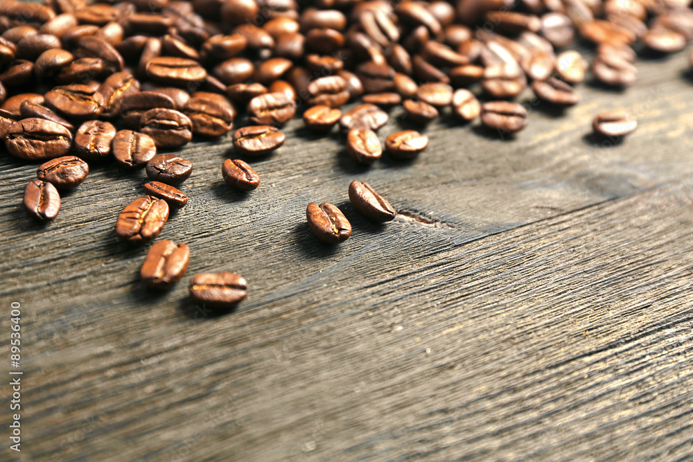 Coffee beans on wooden background