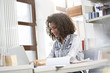 © Westend61 - Young fashion designer working in office