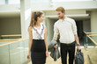 © BGStock72 - Young business couple in the hallway