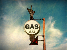 Aged And Worn Vintage Photo Of Cheap Gas Sign