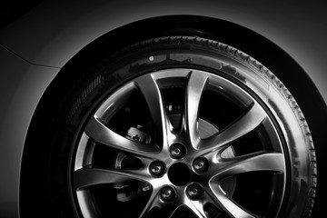 Wall Mural - Close-up of aluminium rim of luxury car wheel