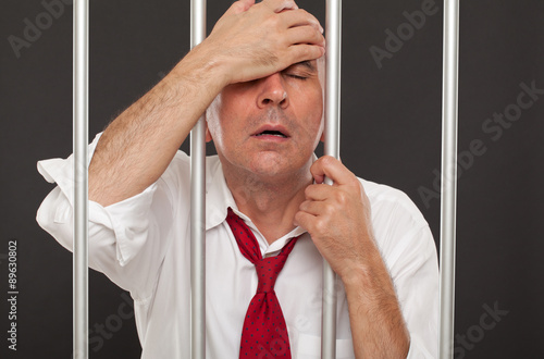 Fotografia, Obraz  Regretful businessman in prison