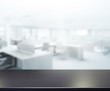 © nuttapol - Table Top And Blur Office Background