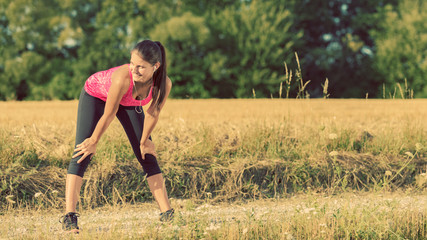 Wall Mural - Attractive female stretching before jogging