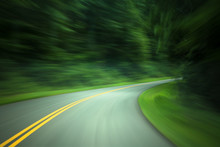 Curved Road Through Country Road With Motion Blur