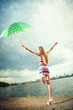 © Aliaksei - girl under an umbrella walks in the rain