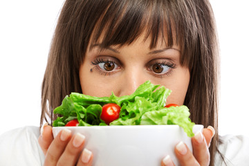 Wall Mural - Young woman preparing healhty salad