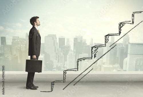 Fotografía Business man climbing up on hand drawn staircase concept