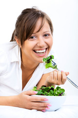 Canvas Print - Young woman eating healthy salad