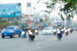 © sutichak - car and motorcycle driving on road with traffic jam in the city, abstract blurred