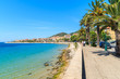 Coastal promenade with palm trees in Ajaccio town, Corsica island, France