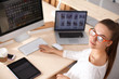 © shefkate - Young woman working in office, sitting at desk