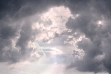 Sunlight Breaking Between Cumulonimbus Clouds