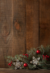 Sticker - Fir branch with Christmas decoration on  old wooden plank.