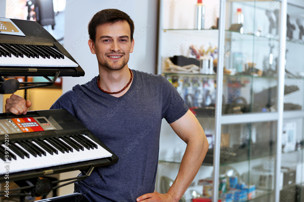 Handsome young man in music store