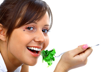 Wall Mural - Young woman eating healthy salad