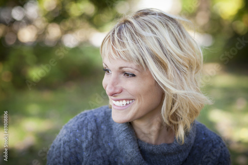 Portrait Of A Mature Woman Smiling And Looking Away Poster