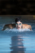 female swimmer swimming butterfly stroke.