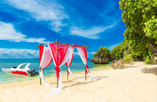 Wedding Ceremony On A Tropical Beach In Red. Arch Decorated With