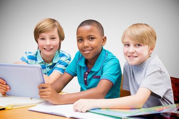 Sticker - Composite image of cute pupils using tablet computer in library