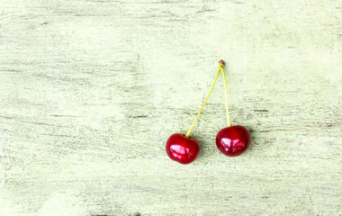 Sticker - Red cherry on a wooden background