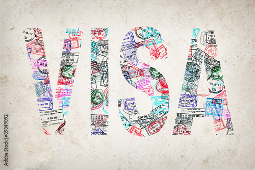 Fotografie, Obraz Word visa created with passport stamps on textured background, travel concept