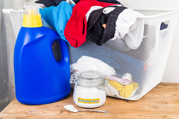 Wall Mural - Baking soda with detergent and pile of dirty laundry.