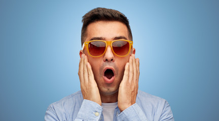 Wall Mural - face of scared man in shirt and sunglasses