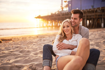 romantic couple having fun at santa monica on beach