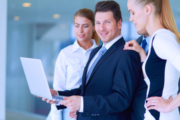 Group of  business people doing presentation with laptop during