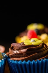 Wall Mural - Delicious cupcakes on a table