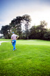 © NDABCREATIVITY - Beautiful golfing scenery with a golfer holding a club