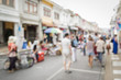 © surasaki - Blurred people on the street in phuket old town