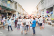 © surasaki - Blurred people on the street in phuket old town