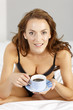 © Studio-FI - Woman enjoying breakfast in bed