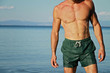 Strong muscular Men, perfect body, abs, six pack, sea, beach, swimwear