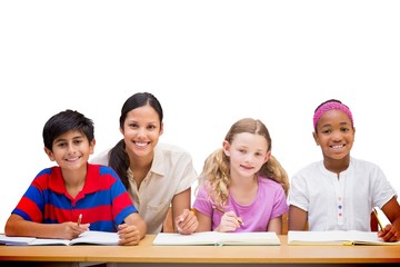 Sticker - Composite image of pretty teacher helping pupils in library