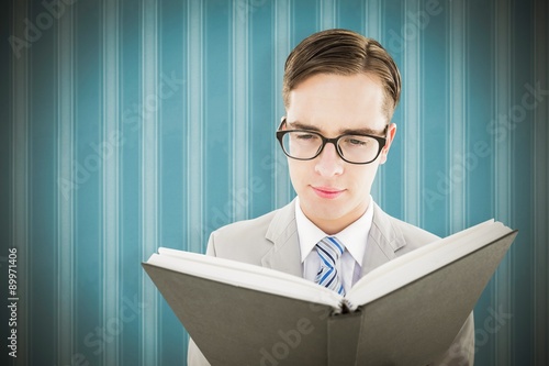 Fotografie, Obraz Composite image of geeky preacher reading from black bible