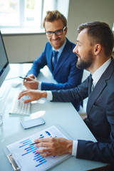 Canvas Print - Businessmen at workplace