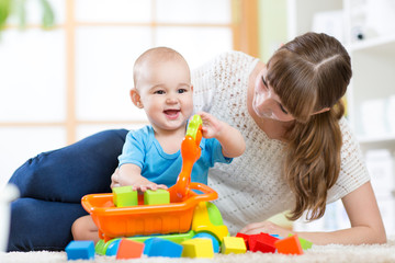 mother with his child son play together