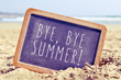 © nito - text bye, bye summer in a chalkboard on the beach