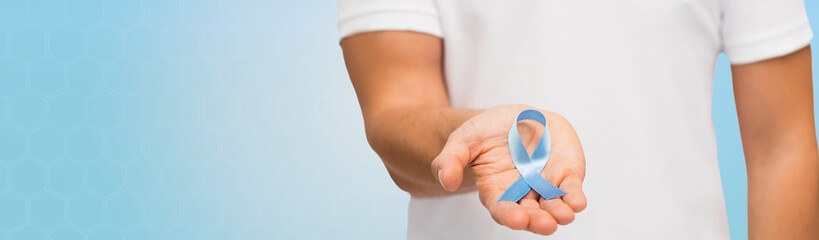 Wall Mural - hand with blue prostate cancer awareness ribbon