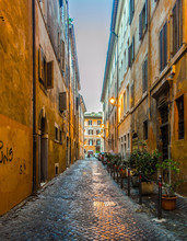 A View Of Sides Streets And Pedestrian Paths Between Buildings In Central Rome At Night