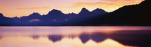 This Is Lake McDonald. There Is A Reflection Of The Mountains In The Lake.